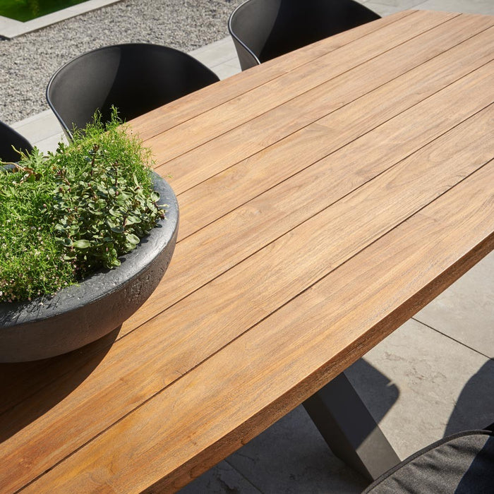 Outdoor dining table TIMOR (rounded) made of teak wood and anthracite aluminum