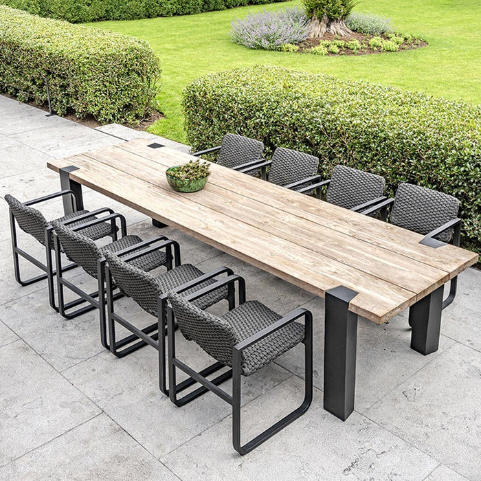 MAESTRO outdoor dining table made of natural regenerated teak and smoked teak legs