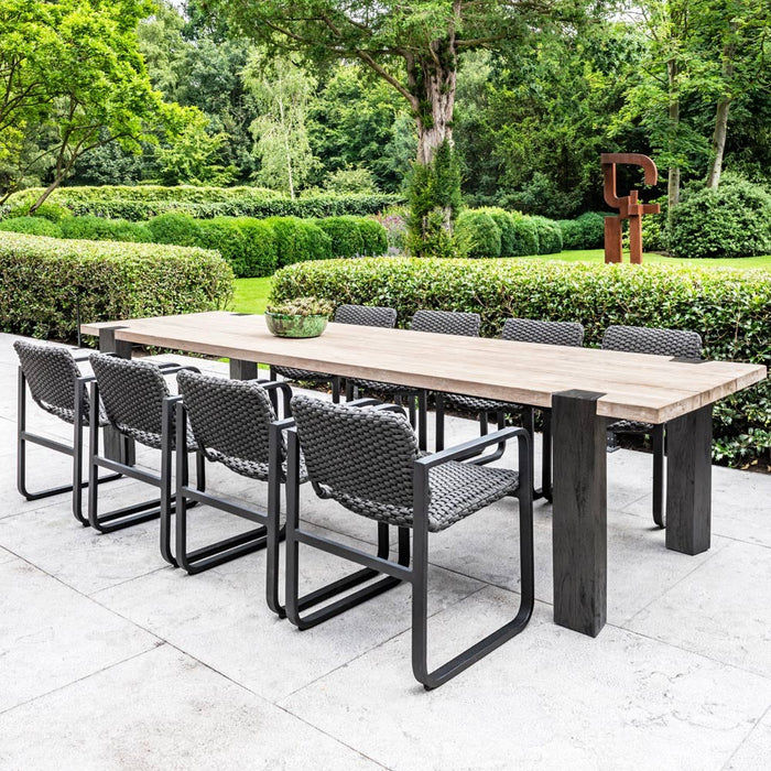 MAESTRO outdoor dining table made of natural regenerated teak and smoked teak legs